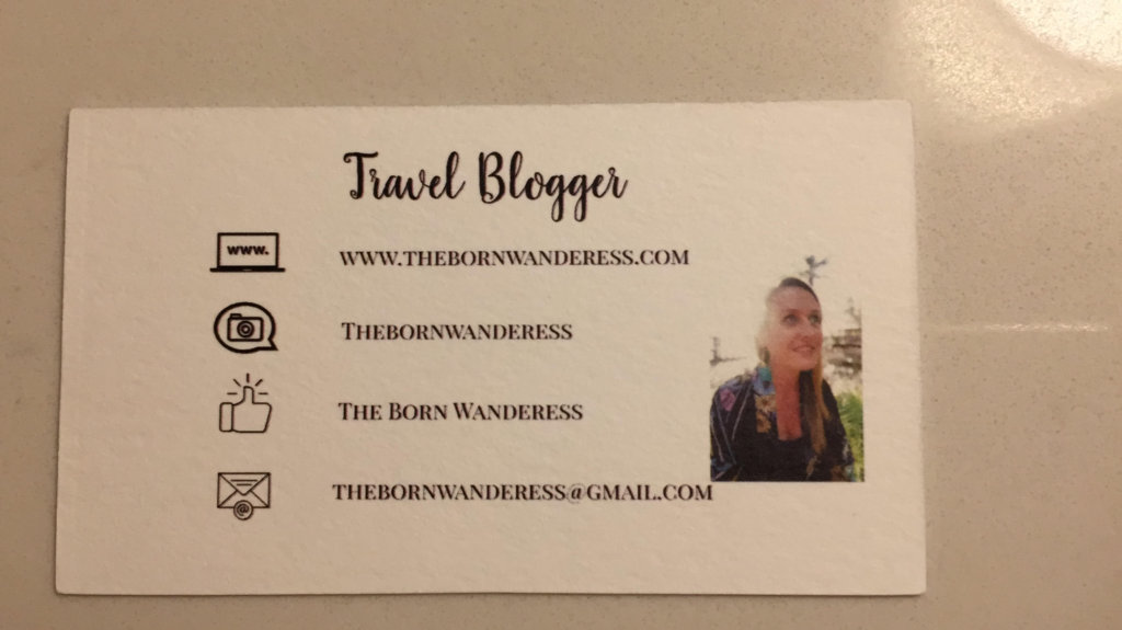 a travel bloggers business card containing her email address, instagram handle, facebook page address and gmail email address. her photo is next to the information on the left