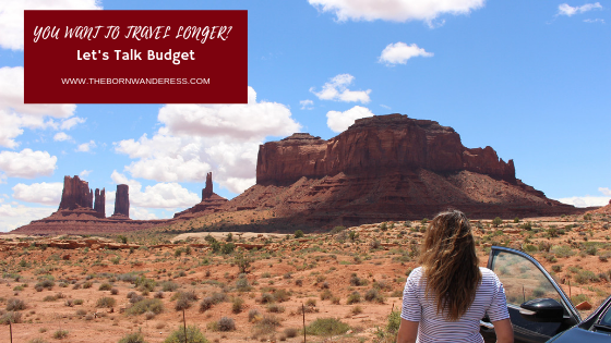 helpful blogs article number 1 header image. woman in white and black striped shirt facing away from camera. she is next to an open car door looking into the distant at cliffs rising dramatically from the ground against a back drop of blue skies litteres with fluffy white clouds