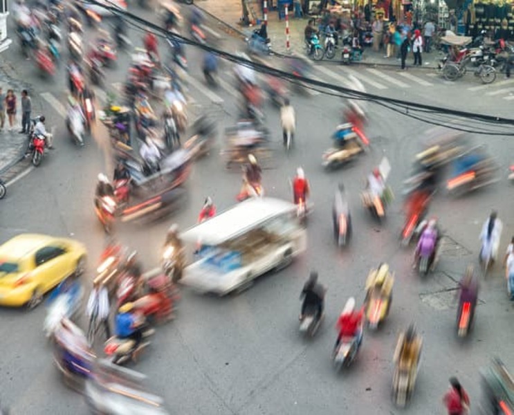 blurry traffic scene at an intersection in Hanoi, Vietnam, Southeast Asia