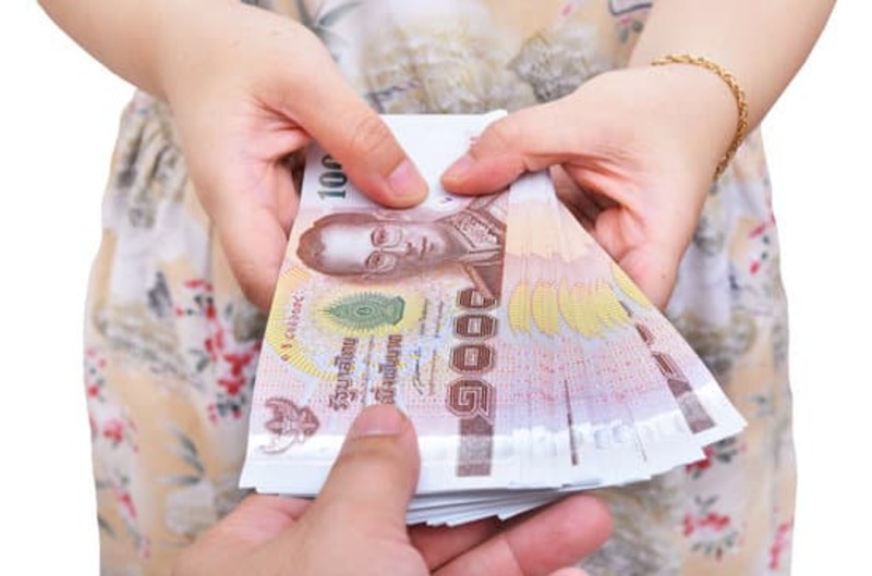 Hand receiving money, Thai money isolated on white background concept