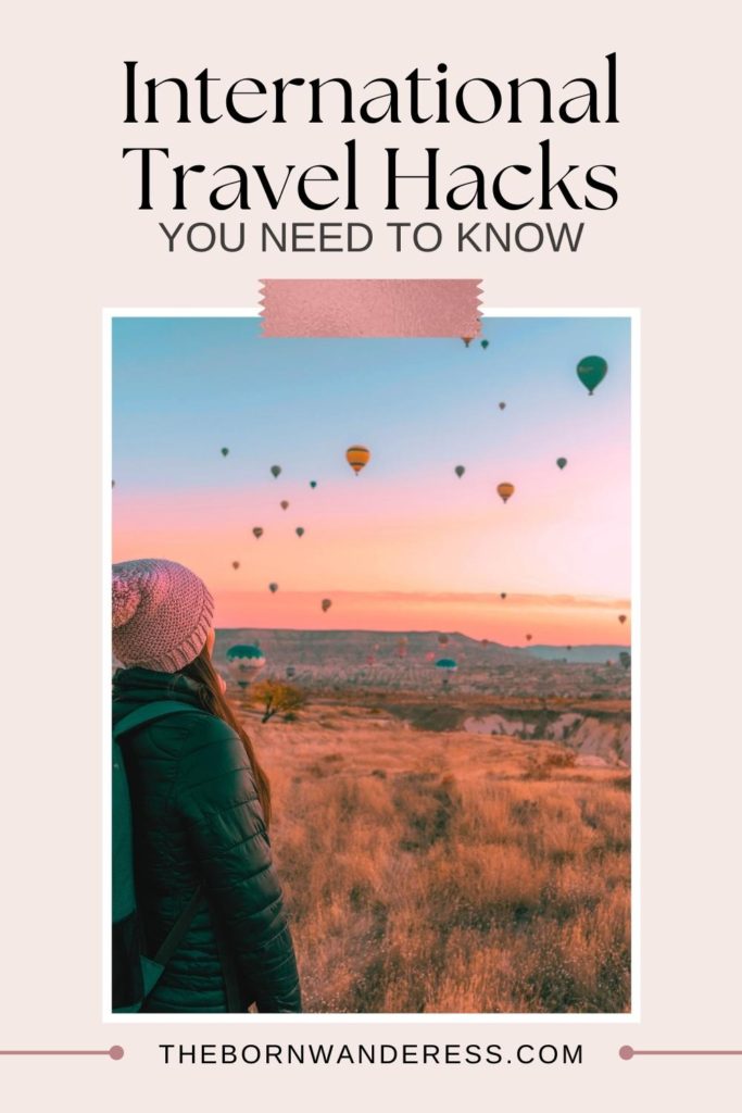 Photo of a woman overlooking a field with tons of hot air balloons in the sky. Text above the photo reads "International Travel Hacks You Need to Knew."