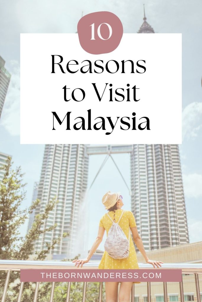 Photo of a woman admiring architecture in Malaysia. Text overlay reads "10 Reasons to Visit Malaysia."