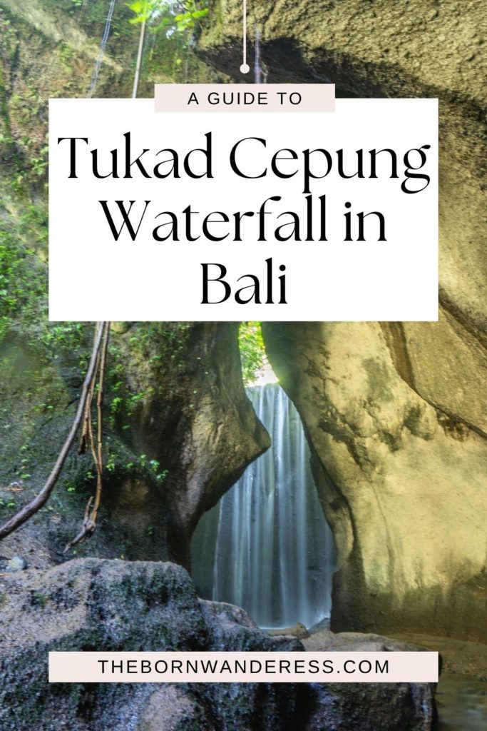 Photo of Tukad Cepung Waterfall in Bali, Indonesia through rock formations.